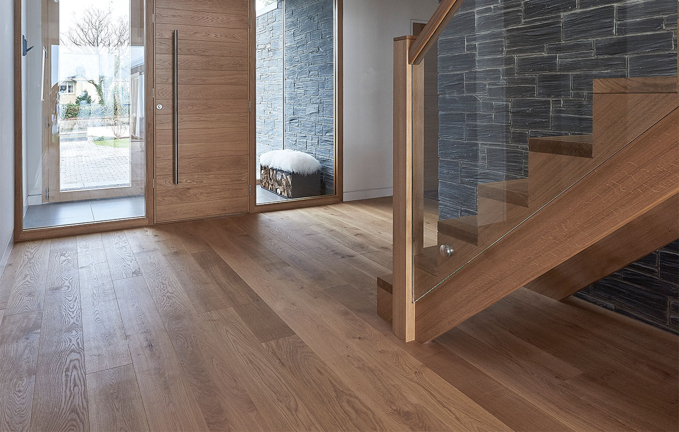 Long engineered wood planks in light natural tone